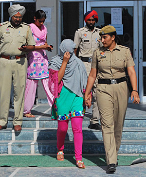 The girl who was accompanying the gangster killed in encounter being produced in the court on Friday.