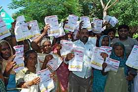 Residents of Danga Peerit Colony and Dhobiana Basti showing their alleged inflated electricity bills in Bathinda on Friday.