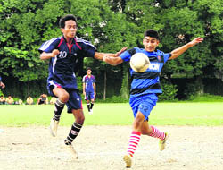 Players in action in a match in the Council Schools Senior Boys' Football Tournament under way at St Joseph's Academy in Dehradun on Friday. 