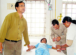 A doctor examines a student in a hospital at Saray Aurangabad village in Jhajjar on Friday