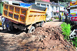A truck stuck in mud at Forsythganj near McLeodganj on Friday