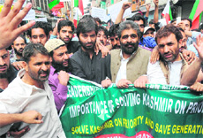 Chairman of the Jammu and Kashmir Liberation Front Yasin Malik leads a protest in Srinagar on Wednesday.
