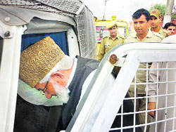Syed Ali Shah Geelani being detained by the police on Friday. 