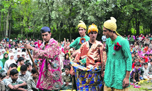 The artistes enacting their roles during a play in Pulwama district on Friday.