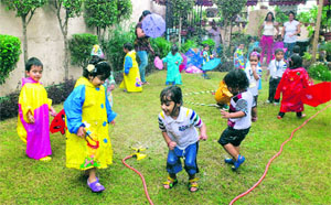Students enjoy a rain dance party at Cherubs The Preschool in Ludhiana on Friday. 