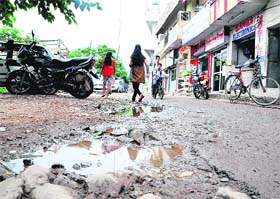 A potholed road at Butterla village in Sector 41, Chandigarh