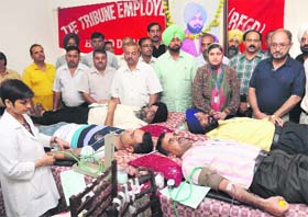 Members of the Tribune Employees Union donate blood on the eve of the 114th death anniversary of the founder of The Tribune Trust, Sardar Dyal Singh Majithia, in Chandigarh on Saturday