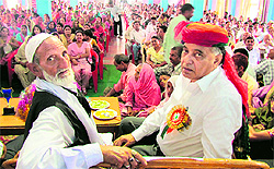 Congress MLA GS Bali (right) addresses party workers during a meeting in Nagrota Bagwan on Saturday