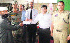 An ex-serviceman being felicitated at a function in Kalakote. 