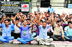 Members of National Youth Corps stage a protest in Jammu on Saturday