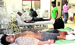 Mahavir, who lost his foot after being crushed by a train on Friday night, undergoes treatment at Civil Hospital in Jalandhar on Saturday
