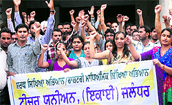 RMSA and SSA teachers protest against the governments rationalisation policy at the DC complex in Jalandhar on Saturday