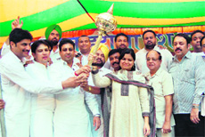 National vice-president of the Bharatiya Janata Yuva Morcha Poonam Mahajan being offered a mace by Rajesh Honey, president of the Punjab unit of the morcha, and other party leaders during a rally in Amritsar on Sunday. 