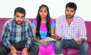 Navdeep Brar (R), Smriti and Sumit (L) address mediapersons at PU on Sunday.