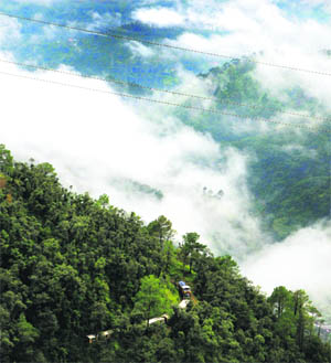 A toy train on the Kalka-Shimla UNESCO World Heritage railway track during a light drizzle in Shimla. 