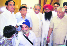 A doctor examines a patient at an eye check-up camp in Kapurthala on Sunday.