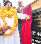 Minister for Relief and Revenue Raman Bhalla lays the foundation stone of a multi-purpose community hall in Jammu on Sunday. 