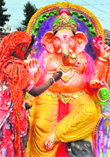 An artist fine tunes an idol of Lord Ganesha ahead of Ganesh Chaturthi in Jammu.