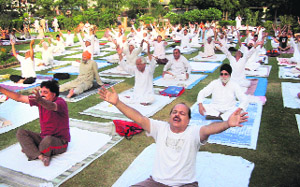 Participants perform yoga during a camp organised by Bhartiya Yoga Sansthan at Shaheed Bhagat Singh Nagar in Ludhiana on Sunday.