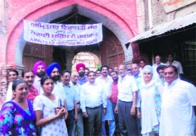 Tourist guides and officials of the Punjab Heritage and Tourism Promotion Board start a door-to-door cleanliness drive en route the heritage walk in Amritsar on Monday