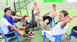 The New Zealand team sits at the playing arena due to the disturbance caused by the heavy noise of drilling and sheet-cutter machines