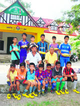 Members of the football team of Gorkha Military Inter-College, who were given football shoes in Dehradun on Monday.
