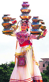 A girl displays her skill during a function at Palwal. 