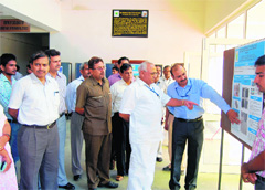 Vice-Chancellor HS Chahal inquires about one of the displays put up in the exhibition on the premises of Murthal university. 