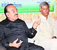 Former PCC chief Kaul Singh Thakur addresses a press conference in Dharamsala on Monday