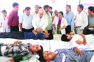 Dr SN Chugh, Pro-Vice-Chairman of the health university, and Dr VK Jain, Dean, visit the blood donation camp organised by medical students at the PGIMS, Rohtak, on Monday
