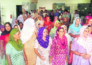 Women residents of Saray Aaurangabad village protest against poor power supply on Monday.
