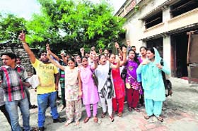 Students protest against the authorities demanding repair of the building in Jammu