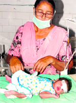 A nurse at the Civil Hospital attends to a baby, who was found abandoned at Johalan village near Rama Mandi in Jalandhar.
