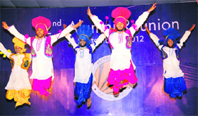 Students perform bhangra on the alumni meet at Lovely Professional University near Jalandhar on Monday.
