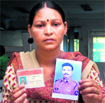 Meenu, wife of Mukesh Kumar, who has been missing for the past five weeks in Jalandhar.
