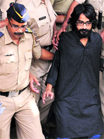 Cartoonist Aseem Trivedi being escorted out of 