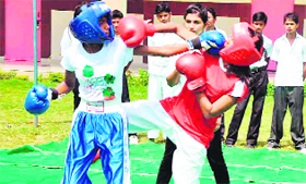 Players in action during the concluding day of the district-level kick-boxing championship at Arya Swaroop Saraswati Vidya Mandir, Roorkee, in Haridwar on Tuesday.