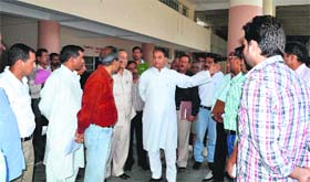 Transport Minister Mohinder Singh Thakur inspects the newly-constructed bus stand in Mandi on Tuesday