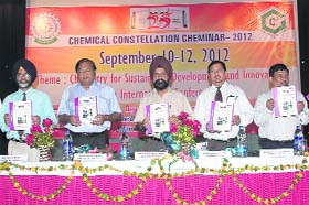 Scientists at Dr BR Ambedkar National Institute of Technology release a souvenir during a chemistry seminar in Jalandhar
