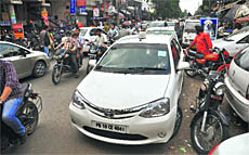 Traffic chaos on a road in Ludhiana due to haphazard parking. 