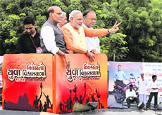 Gujarat Chief Minister Narendra Modi with BJP leaders Rajnath Singh and Arun Jaitley at the launch of Vivekananda Yuva Vikas Yatra in Mehsana district on Tuesday.