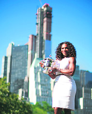 Serena Williams poses with the trophy. 