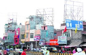 Rooftop hoardings near the Hall Gate area ridicule the ban imposed by the high court in Amritsar