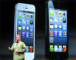 Apple senior vice president Phil Schiller unveils iPhone 5 in San Francisco on Wednesday. The new iPhone is the worlds thinnest smartphone and is 20% lighter than iPhone 4S