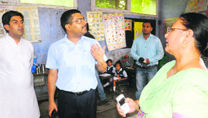 MC Commissioner VP Singh (second from left) inspects a primary school at the PGI, Sector 12, Chandigarh, on Wednesday. 