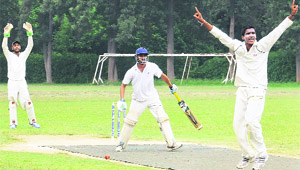 Players in action during a cricket match at Panjab University in Chandigarh on Wednesday. 