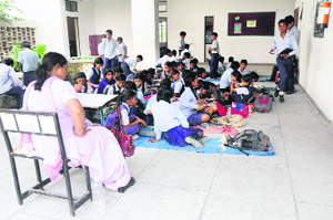 Children sit on the floor at Government Senior Secondary School, Sector 56, Chandigarh. 