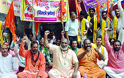 Activists of the Vishwa Hindu Mahasangh led by Mahant Surendranath Avadhoot sit on a dharna against the proposed beef-eating festival at Jawaharlal Nehru University in New Delhi on Wednesday