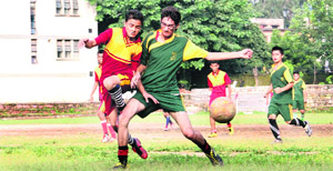 A match in progress in the Dehradun Council Senior Boys' Football Tournament under way at St Josephs Academy in Dehradun on Wednesday. 