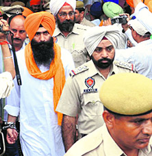 Baksheesh Singh, the main accused in the attack of on the convoy of Dera Sacha Sauda chief, comes out of the court after his conviction in Karnal on Wednesday.